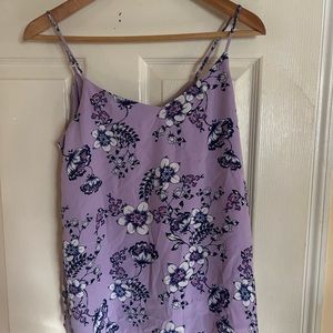I am selling a purple medium size camisole top with flowers for $10.